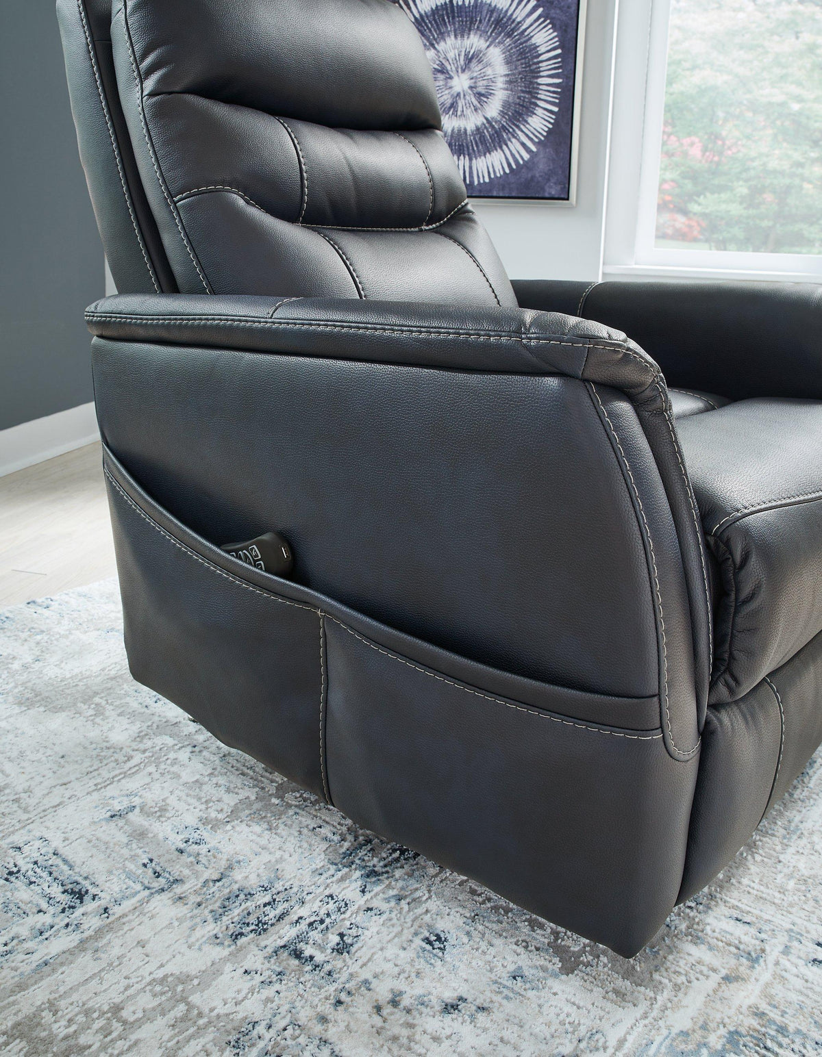 Ashley Furniture Strawbill Power Lift Recliner with plush upholstery and adjustable reclining features.