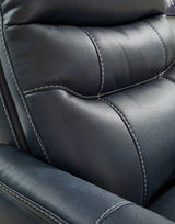 Ashley Furniture Strawbill Power Lift Recliner in brown fabric with plush cushioning and built-in lift mechanism.