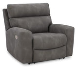 Ashley Furniture Next-Gen DuraPella Power Recliner in dark gray fabric with plush cushioning and sleek armrests.