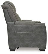 Ashley Furniture Next-Gen DuraPella power recliner with plush cushioning and dark leather upholstery, shown from the side.