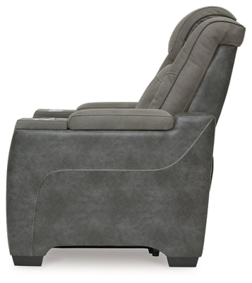 Ashley Furniture Next-Gen DuraPella Power Recliner showing plush cushioned armrests and reclining mechanism in a modern living room setting.