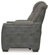 Ashley Furniture Next-Gen DuraPella Power Recliner showing plush cushioned armrests and reclining mechanism in a modern living room setting.
