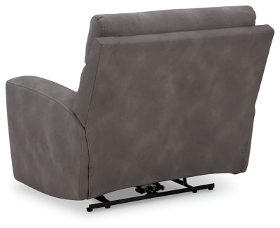 Ashley Furniture Next-Gen DuraPella Power Recliner with plush upholstery and sleek design, shown from the back in a modern living room setting.