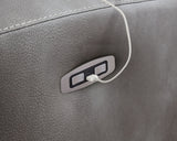 Close-up of Ashley Furniture Next-Gen DuraPella Power Recliner showing detailed upholstery and built-in USB charging port.