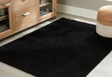 Ashley Furniture Anaben Rug with intricate woven pattern in neutral tones, suitable for living rooms and bedrooms.