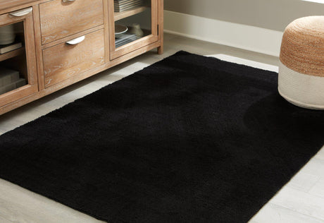 Ashley Furniture Anaben Rug with intricate woven pattern in neutral tones, suitable for living rooms and bedrooms.