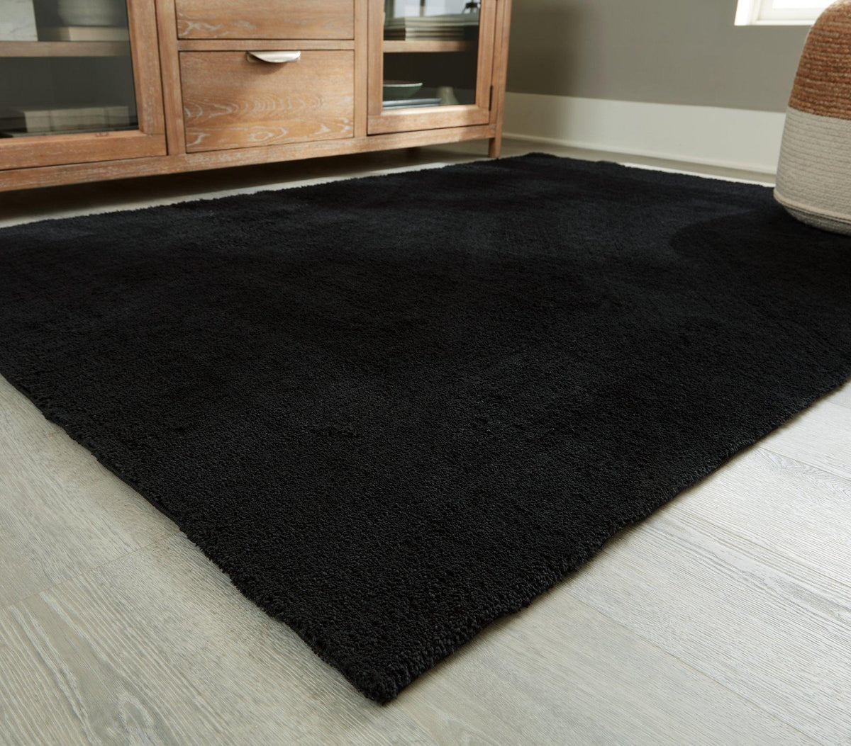 Ashley Furniture Anaben Rug with intricate patterns and soft texture, perfect for adding style to living room or bedroom floors.