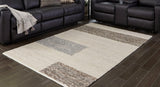 Ashley Furniture Barus Rug featuring a soft, woven texture with geometric patterns in neutral tones.
