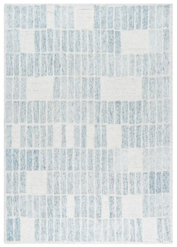 Ashley Furniture Dylanton area rug with intricate pattern in neutral tones, shown in a cozy living room setting.