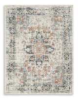 Ashley Furniture Jarrpage Rug with intricate floral patterns and neutral tones, ideal for enhancing living room decor.