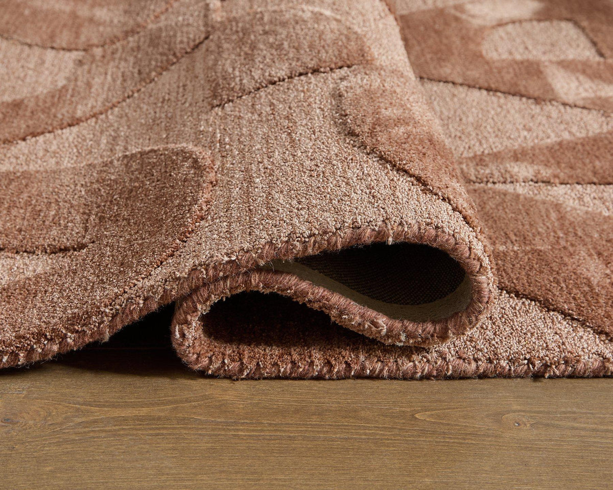 Ashley Furniture Perrenton Rug with intricate pattern in neutral tones, showcasing its soft, woven texture and stylish design.