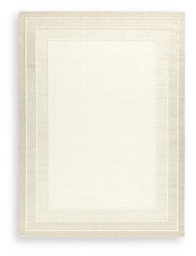 Ashley Furniture Teelgan Rug with intricate patterns in neutral tones, showcasing a plush, woven design for living room decor.