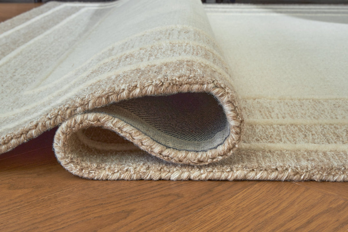 Close-up of Ashley Furniture Teelgan Rug showcasing its intricate woven pattern and textured design.