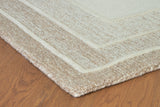 Close-up of the Teelgan Rug by Ashley Furniture, showcasing its detailed woven pattern and soft texture in warm tones.