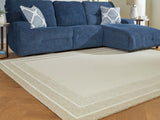 Ashley Furniture Teelgan Rug in neutral tones, showing a close-up of its textured pattern and soft woven surface.