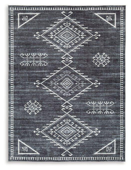 Ashley Furniture Arloman Rug with intricate pattern and warm tones, ideal for adding style to living room or bedroom floors.
