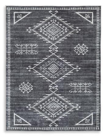 Ashley Furniture Arloman Rug showcasing soft, woven texture with intricate patterns in warm neutral tones.