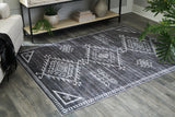 Ashley Furniture Arloman Rug with intricate patterns and soft texture, perfect for adding style to living spaces.
