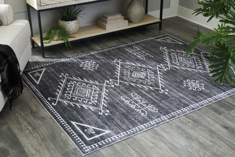 Ashley Furniture Arloman Rug with intricate patterns and soft texture, perfect for adding style to living spaces.