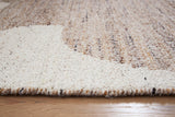 Ashley Furniture Brynnfield 5' x 7' rug with intricate pattern in neutral tones, ideal for living room or bedroom decor.
