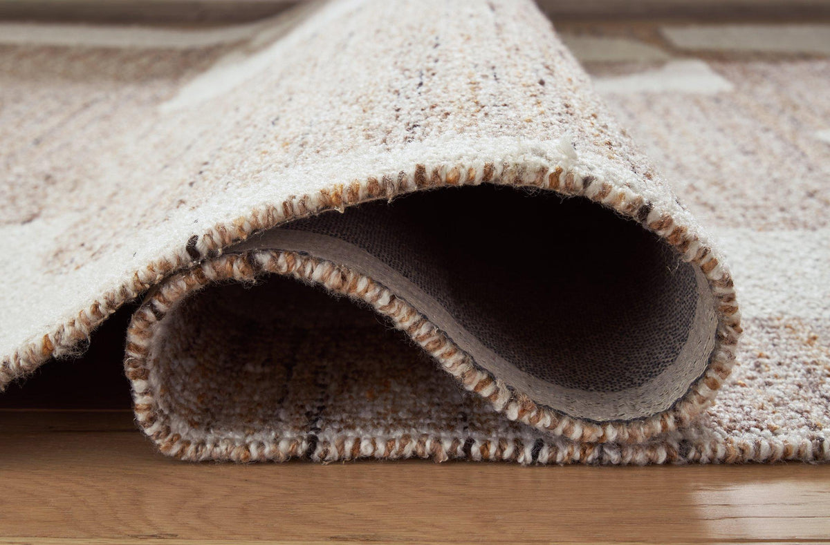 Ashley Furniture Brynnfield 8x10 rug with intricate patterns in neutral tones, perfect for adding style to living spaces.