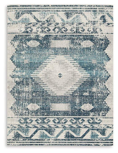 Ashley Furniture Daddridge 5' x 7' Rug with intricate patterns and soft texture, ideal for living rooms or bedrooms.