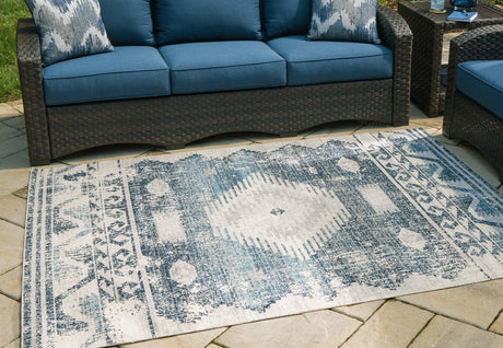 Ashley Furniture Daddridge 5x7 rug with intricate patterns in warm tones, perfect for living rooms or bedrooms.