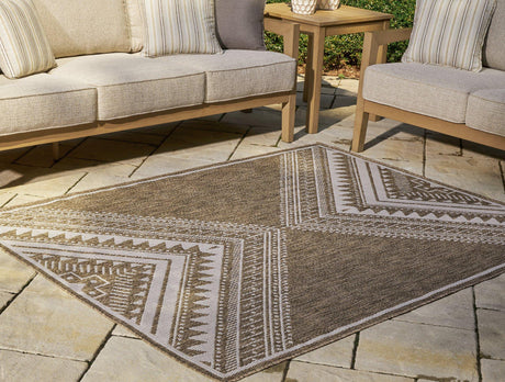 Ashley Furniture Dunsler 5x7 rug with intricate patterns in neutral tones, perfect for living rooms or bedrooms.