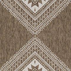 Ashley Furniture Dunsler 5' x 7' rug with intricate patterns and soft texture, ideal for living room or bedroom decor.