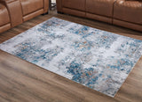Ashley Furniture Garyard 5' x 7' rug featuring a stylish pattern and soft texture, perfect for enhancing living room decor.