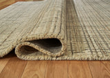 Close-up of Ashley Furniture Janston Rug with detailed woven pattern in neutral tones, showcasing soft texture and intricate design.