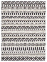 Ashley Furniture Karalee 5x7 rug with a soft, textured pattern in neutral tones, perfect for adding warmth to living spaces.