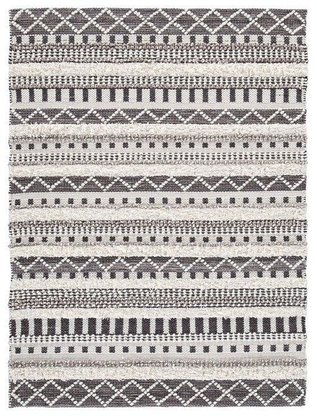 Ashley Furniture Karalee 5x7 rug with a soft, textured pattern in neutral tones, perfect for adding warmth to living spaces.