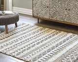 Ashley Furniture Karalee 8' x 10' rug with intricate patterns and soft textures, ideal for enhancing living room decor.