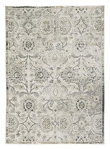Ashley Furniture Kilkenny 7'10" x 10'2" rug with intricate pattern and soft texture, ideal for living room or bedroom decor.