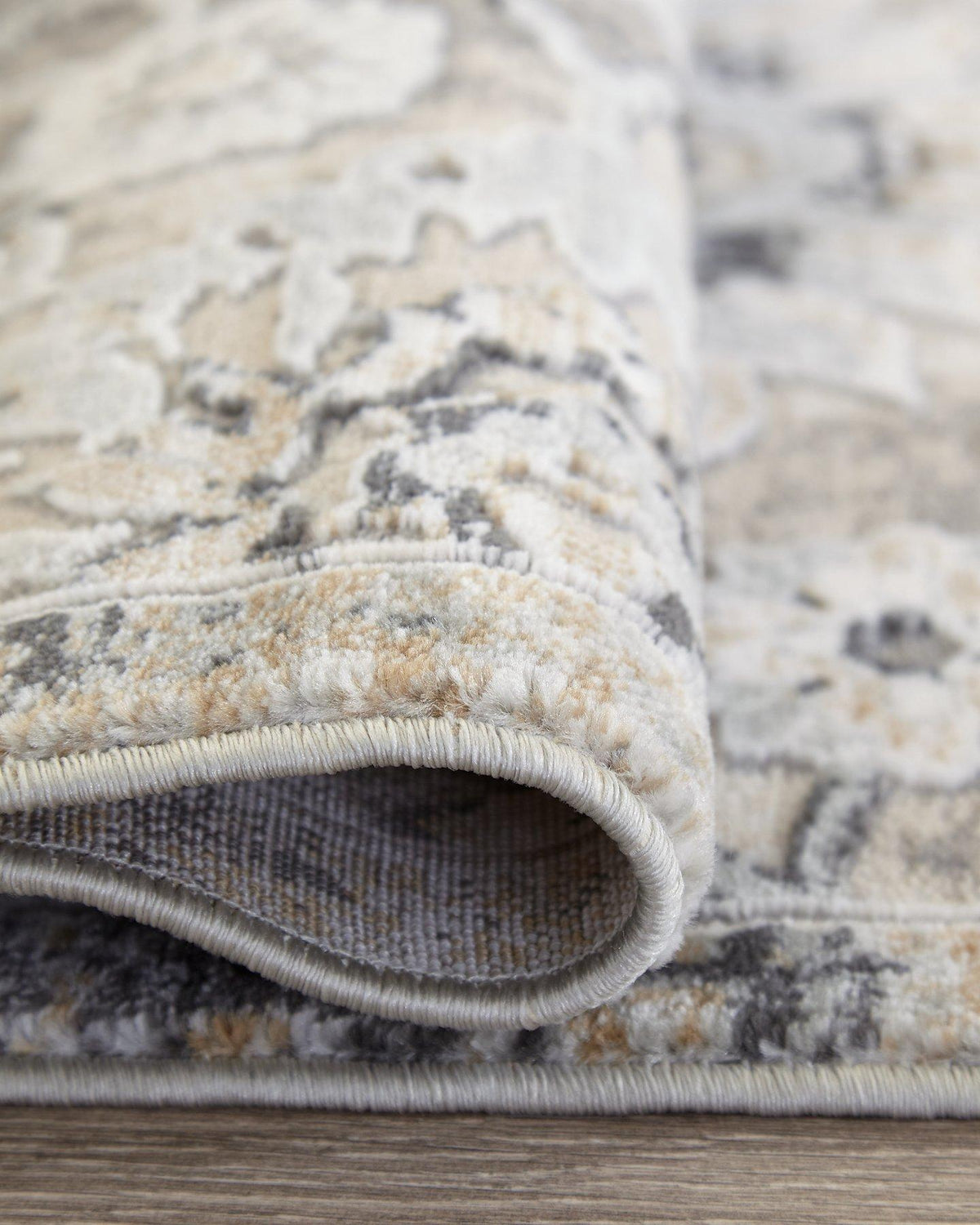 Ashley Furniture Kilkenny rug, 7'10" x 10'2", with intricate patterns and soft texture, ideal for living room or bedroom decor.