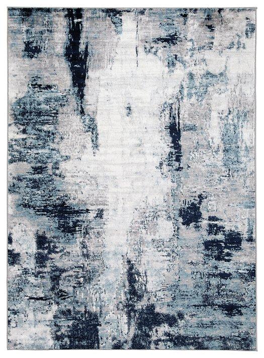 Ashley Furniture Leonelle 5'3" x 7'3" rug with intricate pattern and soft texture, perfect for adding style to any room.
