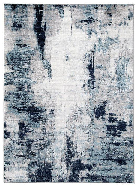 Ashley Furniture Leonelle 5'3" x 7'3" rug with intricate pattern and soft texture, perfect for adding style to any room.