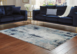 Ashley Furniture Leonelle 5'3" x 7'3" rug featuring a stylish design perfect for living rooms or bedrooms.