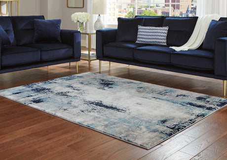 Ashley Furniture Leonelle 5'3" x 7'3" rug featuring a stylish design perfect for living rooms or bedrooms.