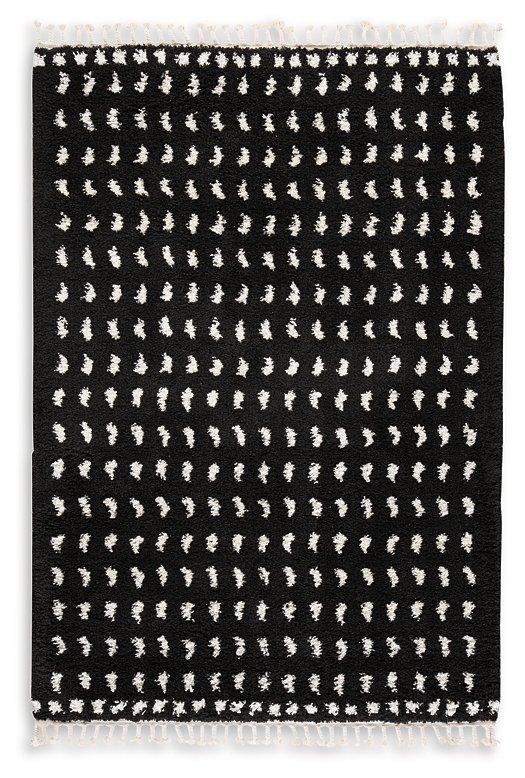 Ashley Furniture Minston 5' x 7' rug with intricate geometric patterns in neutral tones for living room or bedroom decor.