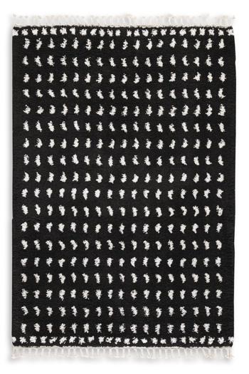 Ashley Furniture Minston 5' x 7' rug with intricate patterns and soft texture, ideal for living rooms or bedrooms.