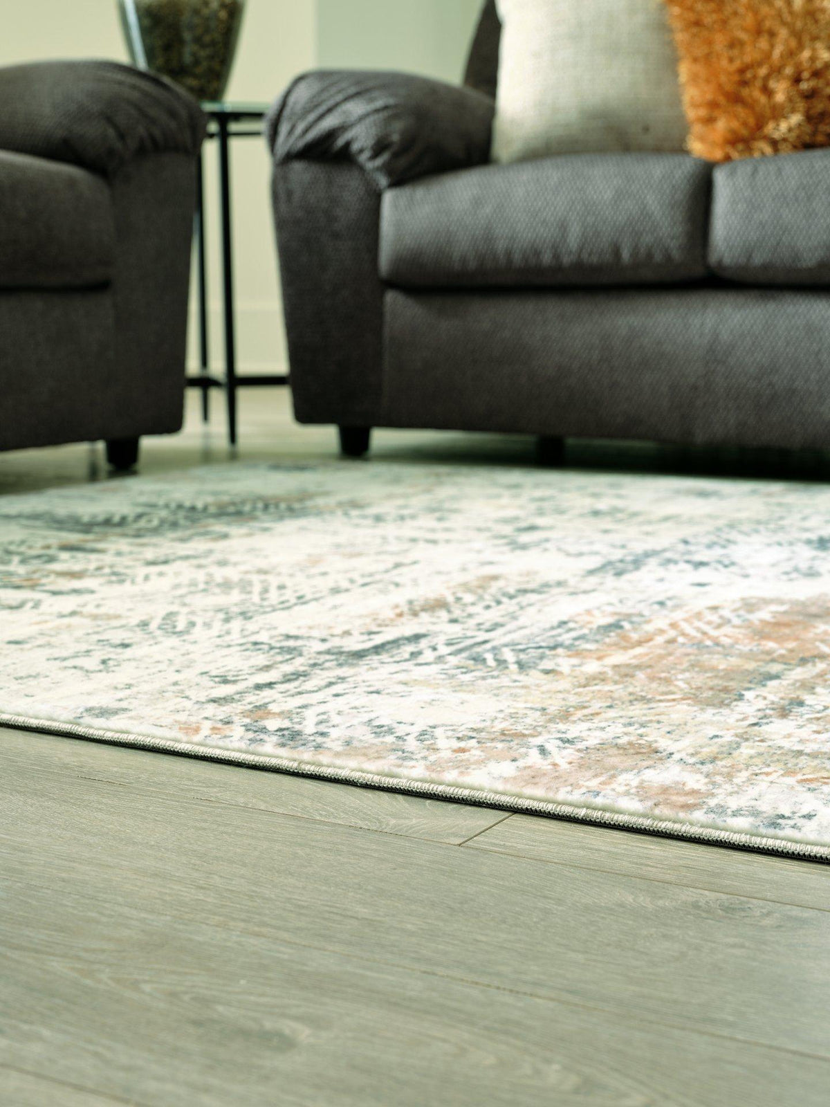 Redlings 5x7 rug by Ashley Furniture featuring a cozy, patterned design in rich red tones for living room or bedroom decor.