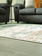 Redlings 5x7 rug by Ashley Furniture featuring a cozy, patterned design in rich red tones for living room or bedroom decor.