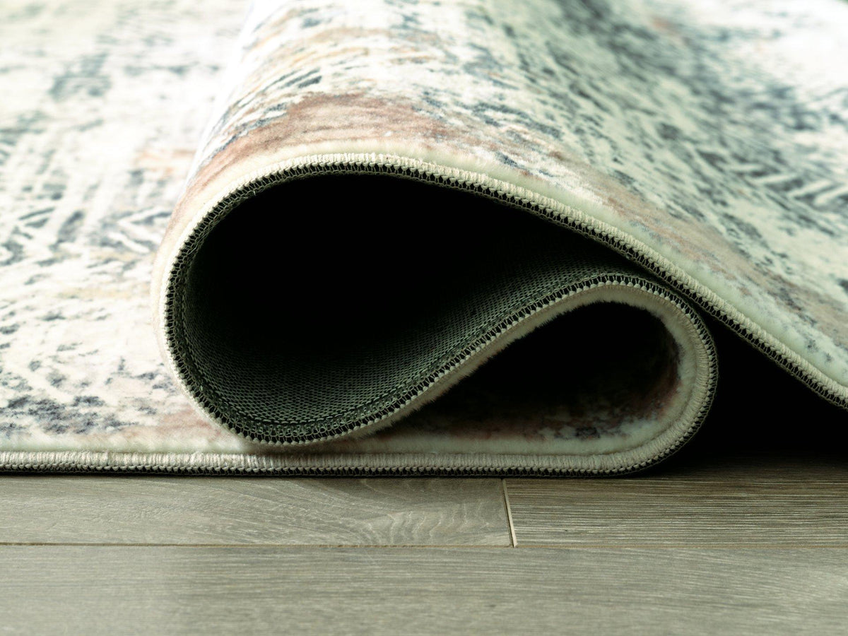Redlings 5x7 rug by Ashley Furniture with a vibrant red pattern, perfect for adding warmth and style to living spaces.