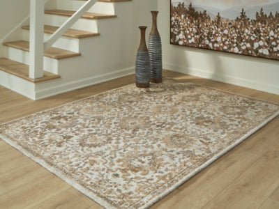 Ashley Furniture Sableridge medium rug with intricate patterns and neutral tones, perfect for living rooms or bedrooms.