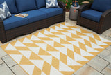 Ashley Furniture Thomley 5' x 7' rug with a soft, patterned design suitable for living rooms or bedrooms.