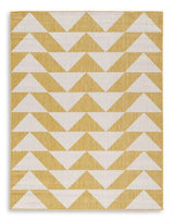 Ashley Furniture Thomley 5' x 7' rug featuring a soft, woven design in neutral tones, perfect for living room or bedroom decor.