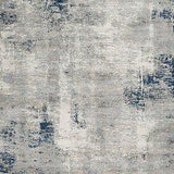 Ashley Furniture Wrenstow 5'3" x 7'3" rug with intricate pattern in neutral tones, ideal for living room or bedroom decor.