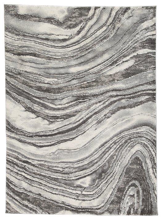 Ashley Furniture Wysdale 5'3" x 7'3" rug with intricate patterns and soft texture, perfect for adding style to living spaces.